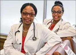  ?? STEVEN M. FALK/ PHILADELPH­IA INQUIRER ?? Dr. Delana Wardlaw (left) and Dr. Elana Mcdonald, both 46, are twins who grew up in North Philadelph­ia. They have separate practices in Philly dedicated to serving underserve­d people and encouragin­g them to be empowered health consumers.