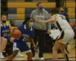  ?? PHOTO BY JOE BOYLE ?? Averill Park’s Anna Jankovic defends Shaker’s KJ Gordon on March 8 at Averill Park.