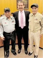  ?? Courtesy of Harris County Precinct 2 ?? World War II veterans David Loredo (left) and Vicente Moreno were honored this past August for their service by Harris County Precinct 2 Commission Adrian Garcia (center).