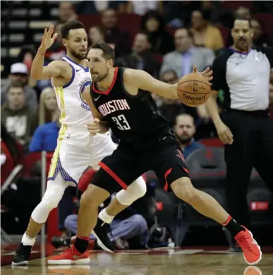  ?? Associated Press ?? Houston Rockets' Ryan Anderson (33) drives toward the basket as Golden State Warriors' Stephen Curry defends during the first half of an NBA basketball game Thursday in Houston.