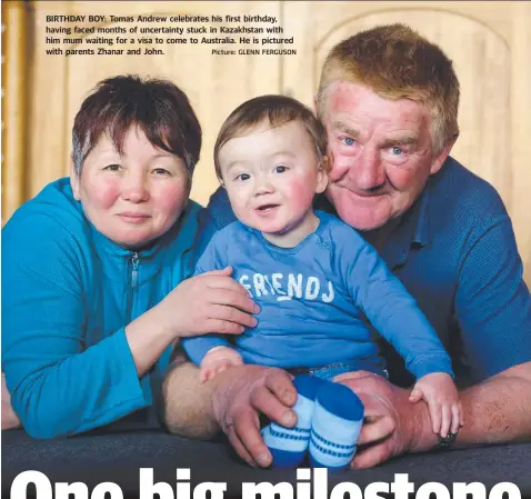  ?? Picture: GLENN FERGUSON ?? BIRTHDAY BOY: Tomas Andrew celebrates his first birthday, having faced months of uncertaint­y stuck in Kazakhstan with him mum waiting for a visa to come to Australia. He is pictured with parents Zhanar and John.