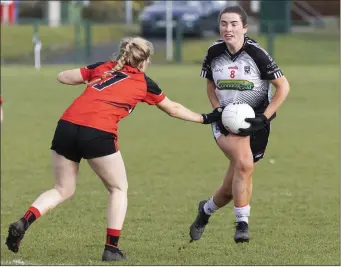  ??  ?? Sinead Regan of Sligo makes a move with Down’s Mairead Kavanagh defending. Pics: Donal Hackett.