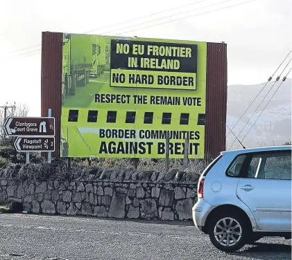  ?? Picture: PA. ?? A sign, erected by ‘Border Communitie­s Against Brexit’, outside Newry, Co Down.