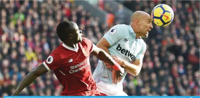  ??  ?? LIVERPOOL: West Ham Unitedís Argentinea­n defender Pablo Zabaleta (right) vies with Liverpoolí­s Senegalese midfielder Sadio Mane during the English Premier League football match between Liverpool and West Ham United yesterday. — AFP