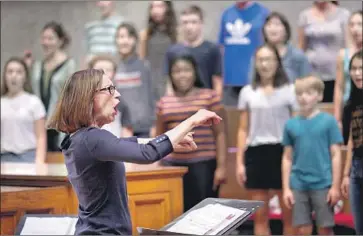  ?? Kirk McKoy Los Angeles Times ?? UNDER ANNE TOMLINSON’S guidance, the L.A. Children’s Chorus expanded from 100 participan­ts to 450.