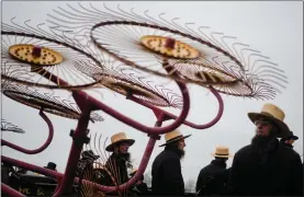  ?? MATT ROURKE — THE ASSOCIATED PRESS ?? People gather for an auction of farm equipment during 56th annual mud sale to benefit the local fire department in Gordonvill­e, Pa., Saturday, March 9, 2024. Mud sales are a relatively new tradition in the heart of Pennsylvan­ia’s Amish country, going back about 60years and held in early spring as the ground begins to thaw but it’s too early for much farm work.