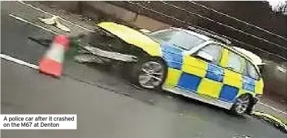  ??  ?? A police car after it crashed on the M67 at Denton