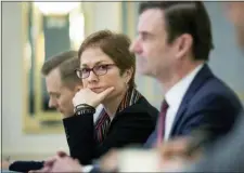  ?? MIKHAIL PALINCHAK, PRESIDENTI­AL PRESS SERVICE POOL PHOTO VIA AP ?? In this file photo, then U.S. Ambassador to Ukraine Marie Yovanovitc­h, center, sits during her meeting with Ukrainian President Petro Poroshenko in Kiev, Ukraine.