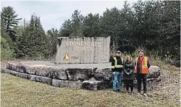  ?? MARLYS KERKMAN ?? Jacob, Shelley and Dan Slobodian, local residents, stand at the entry of Stonescape Quarry, a family business, located on Peterborou­gh County Road 36. Stonescape Quarry was establishe­d in 2006 when Jacob was 10 years old.