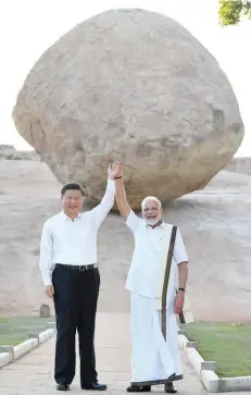  ??  ?? Prime Minister Narendra Modi and the President of China Xi Jinping at Krishna’s Butter Ball in Mamallapur­am.