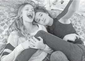  ?? Open Road Films ?? Halston Sage, left, and Zoey Deutch portray high school friends in “Before I Fall.”