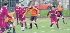  ??  ?? DUSC (tangerine) beat Arbroath Lads 5-1 in an U/14 Reilly Falconer Cup first-round tie at Craigie 3G.