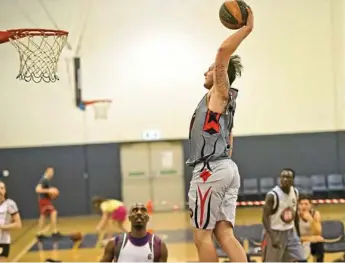  ?? Photos: Nev Madsen ?? SENDING IT HOME: Josh Derksen prepares to launch a physical tirade on the rim during the Runnin’ Rebels’ loss to the Wildcats.