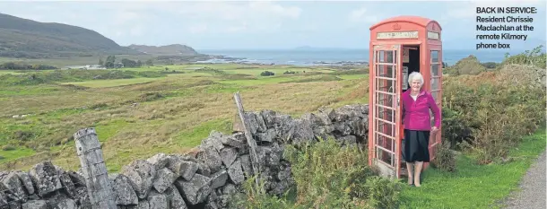  ??  ?? BACK IN SERVICE: Resident Chrissie Maclachlan at the remote Kilmory phone box