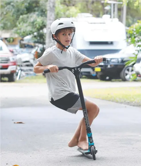  ?? Picture: BRENDAN RADKE ?? ACTIVE: Andrew Snyman, 9, of Brisbane, rides his scooter at the NRMA Palm Cove Holiday Park.