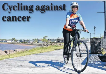  ?? DESIREE ANSTEY/JOURNAL PIONEER ?? Catherine Coulson Gaudet cycles along the Summerside boardwalk in an effort to raise funds for kids with cancer because she believes “kids should be living life, not fighting for it.”