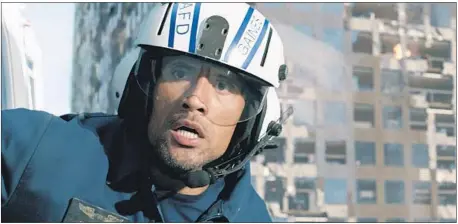  ?? Associated Press ?? DWAYNE JOHNSON in a scene from the film “San Andreas.” The earthquake thriller was the top performer in theaters on Friday.