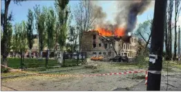  ?? AP/PTI ?? A photo made available by National Police of Ukraine, a Policlinic is engulfed in flames following a Russian attack in Dnipro on Friday