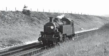  ?? R N Smith Collection ?? Ivatt hunting at Lymington had the advantage of locomotive changeover­s. No 41224 returns light engine from Bournemout­h shed on duty 404 on Tuesday, 31 May 1966. The duty started at 05.45 from Lymington shed, with the engine operating two return passenger trips on the branch, these were worked by a local crew before they handed over to a Bournemout­h crew for the 07.56 passenger train from Brockenhur­st to Bournemout­h (Central). The engine then spent the day around Bournemout­h and Poole on various jobs, including banking, before ending up on Bournemout­h shed, where an engine swap may occur, before departure at 17.52 light engine back to Brockenhur­st, where the engine was handed over to the Lymington crew for two trips to Lymington Pier. It then retired to Lymington shed, ready for the following day. Other branch trains were covered by Eastleigh duty 314 and Bournemout­h duty 400, both booked for a BR Standard ‘4MT’ 2-6-4T.