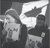  ?? TYLER ANDERSON/NATIONAL POST ?? Mourners hold pictures of John Gallagher during a memorial ceremony in Toronto on Friday.