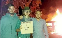  ?? PHOTO: SUPPLIED/KELLY ELLIS ?? Tourists Rob, Charlie and Gwen reassure their mum they are OK after their car exploded in a ball of flames near Whangamomo­na in East Taranaki.