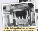  ??  ?? 1918 • SuffragetT­es hold up banner in front of National Women’s Party building. Buyenlarge via Getty Images