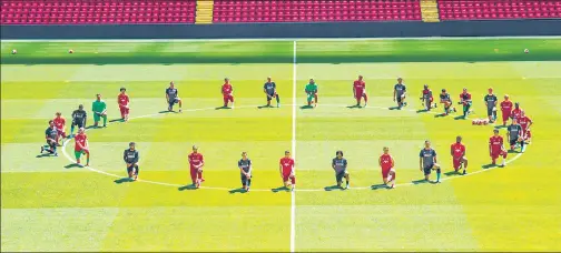  ?? TWITTER ?? Liverpool players including Virgil van Dijk, Trent Alexander-arnold and captain Jordan Henderson take a knee before training at Anfield on Monday. n