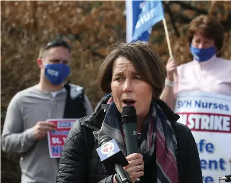  ?? NAncy lAnE / hErAld stAFF FIlE ?? DRUMMING UP SUPPORT: Attorney General Maura Healey greets striking nurses on the picket line outside St. Vincent Hospital in Worcester on Wednesday. She also visited a Brockton food pantry recently.
