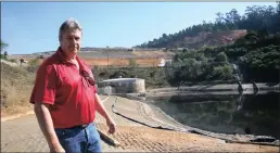  ??  ?? Enviroserv’s group operations director Nicovermeu­len at one of the contaminat­ed storm water dams which is at capacity.