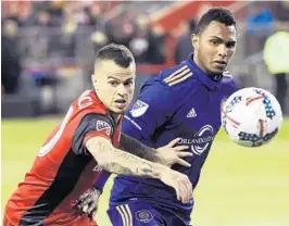  ?? NATHAN DENETTE/AP ?? Orlando City defender Tommy Redding, right, said he is inspired by the success of the Orlando Pride and OCB as the Lions push to make the playoffs.