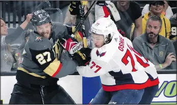  ?? BRUCE BENNETT/GETTY IMAGES ?? Shea Theodore (left) and T.J. Oshie battle last night. Either Vegas or Washington has been involved in eight of the 10 overtimes so far in these playoffs.