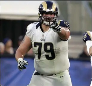  ??  ?? In this Dec. 11, 2016, file photo Los Angeles Rams o ensive tackle Rob Havenstein (79) points to a player during the first half of an NFL football game against the Atlanta Falcons in Los Angeles. AP PHOTO/RICK SCUTERI