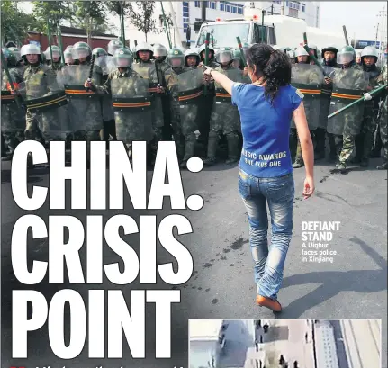  ??  ?? DEFIANT STAND
A Uighur faces police in Xinjiang