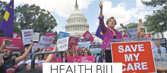  ?? ASTRID RIECKEN, GETTY IMAGES ?? Sen. Elizabeth Warren, D- Mass., speaks at a rally to oppose the repeal of the Affordable Care Act on Capitol Hill on Wednesday.