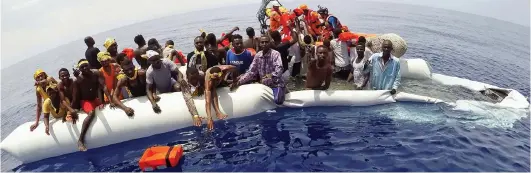  ??  ?? Arrivals: Charities have been accused of encouragin­g migrants to cross the Med. Some 95,215 have made it to Italy this year