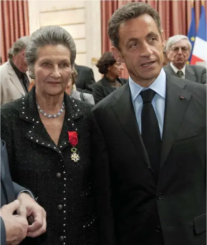  ??  ?? Simone Veil, with former French president Nicolas Sarkozy, is named Grand Officier of the Légion d’Honneur in 2009. This week, she became only the fifth woman to be buried in the Panthéon in Paris. There are 72 men