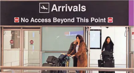  ??  ?? Passengers arrive through the U.S. Customs gate at Logan Internatio­nal Airport in Boston. U.S. travel executives are trying to encourage more internatio­nal visitors. CJ GUNTHER/EPA-EFE