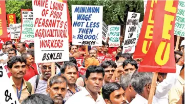  ??  ?? Protesters take part in a protest rally called by the Centre of Indian Trade Unions (CITU), affiliated with the Communist Party of IndiaMarxi­st (CPI-M), in New Delhi. The protesters who travelled from across India were in the capital demanding the national government implement effective labour laws, pushing for a minimum wage, more employment opportunit­ies, and the recognitio­n of Anganwadi workers who work at rural child care centres. — AFP photo