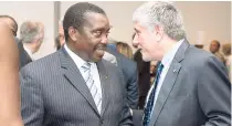  ??  ?? Minister of Security Robert ‘Bobby’ Montague (left) catching up with the man of the hour, United States Ambassador to Jamaica Luis Moreno.