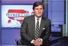  ?? RICHARD DREW/AP ?? Fox News Channel’s prime-time opinion programmin­g, which includes a show hosted by Tucker Carlson, has performed better than its daytime news programmin­g during the network's slide from the No. 1 viewer ranking after the November election.