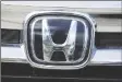  ?? DAVID ZALUBOWSKI/AP ?? THE HONDA COMPANY LOGO is shown outside a Honda dealership on Sept. 12, 2021, in Highlands Ranch, Colo.