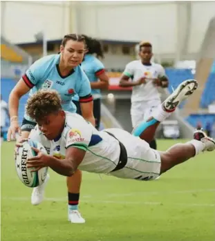  ?? ?? Rooster Chicken Fijiana Drua winger Vitalina Naibore dives to score a try against Waratahs.