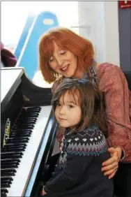  ??  ?? An introducti­on to music and piano instructio­n with Teaching Artist Tina Simon was a big hit with young learners during the morning event.