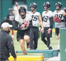  ?? CP PHOTO ?? Ottawa Redblacks fullback Dakota Brush, second from left, runs a drill during practice ahead of the 106th Grey Cup against the Calgary Stampeders in Edmonton on Friday.