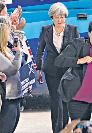  ??  ?? Ruth Davidson, the Scottish Conservati­ve leader, leads Theresa May on a campaign visit in Edinburgh