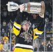  ?? AARON BELL OHL IMAGES ?? Brandon Saigeon with the OHL championsh­ip trophy last spring.