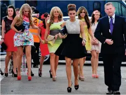  ??  ?? They’re off! Coleen leads the glam pack at Aintree 2012