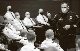  ?? Melissa Phillip / Staff photograph­er ?? Police Chief Art Acevedo speaks with cadets on their first day of police academy training on Monday. They face training amid the COVID-19 pandemic.