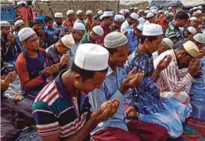  ?? AFP PIC ?? Rohingya refugees offering Aidilfitri prayers at a camp mosque in Kutupalong camp, Cox’s Bazar, on Saturday.