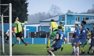  ?? James Eastup ?? Peter Wylie heads home the second goal for Runcorn Linnets against Ramsbottom United last Saturday afternoon.